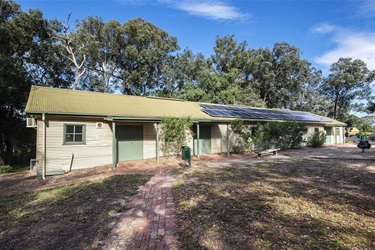 Exterior view of the Briar Hill Community Hall from the paths leading up to the building