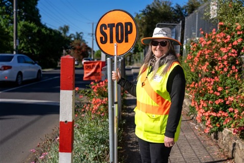 Crossing guard with sign