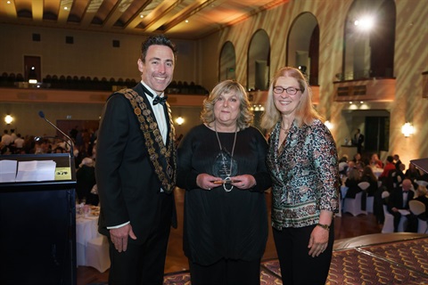 Banyule citizen of the year poses with councillors