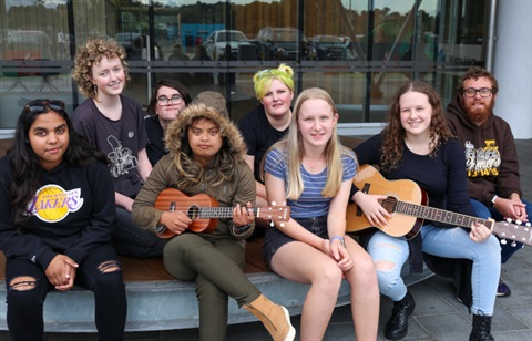 Youth age 12-25 sitting in a group