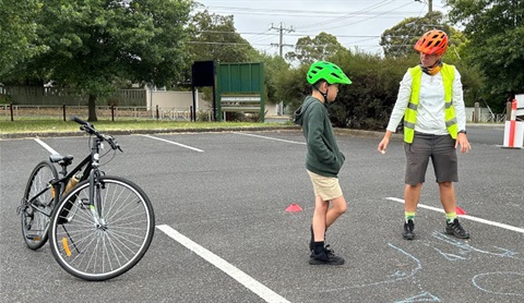 Cycling instructor and child student