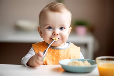 Infant eating breakfast