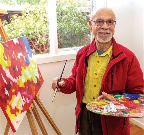 Older painter with an easel