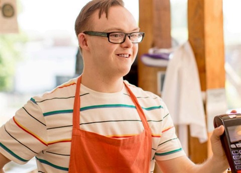 Disabled store clerk at point of sale.